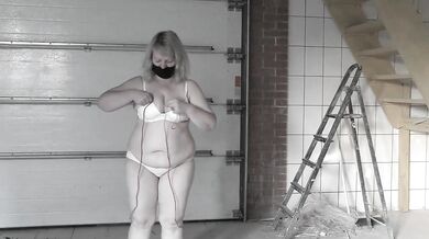 A mature bbw milf with a hairy pussy and big saggy natural tits is jumping rope.