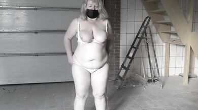 A mature bbw milf with a hairy pussy and big saggy natural tits is jumping rope.