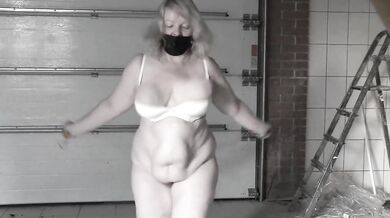 A mature bbw milf with a hairy pussy and big saggy natural tits is jumping rope.