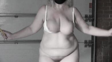 A mature bbw milf with a hairy pussy and big saggy natural tits is jumping rope.