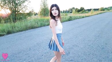 A romantic evening walk in nature ended with sex in clothes in a beautiful meadow next to the road