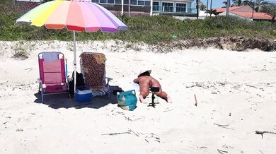SHOWING BUTT PLUG ON THE BEACH