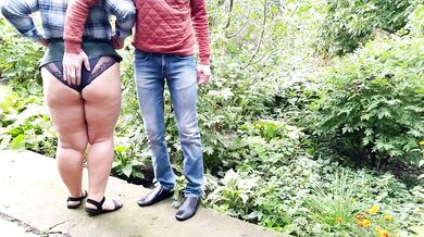 MILF gives golden shower after helping man pee outside
