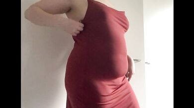 Round fat belly in a red dress