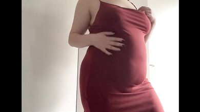 Round fat belly in a red dress