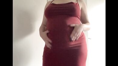 Round fat belly in a red dress