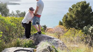 Spontaneous sex while hiking with a view over the city