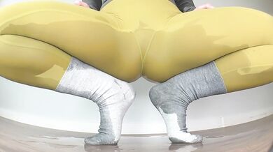 Close-Up Floor Peeing in Yoga Pants in Various Poses