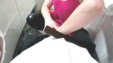 Quick bathroom handjob at a house party, big ass in leather leggings