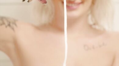 Hot blond Norwegian girl showing off her body in the shower.