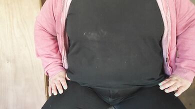 Fat mom touching her stomach