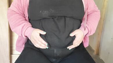 Fat mom touching her stomach