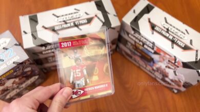 YouTuber opens football cards live, gets surprise facial