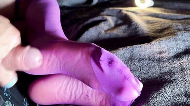 I jerk his cock and balls with my stockings, he rewards me with a cumshot on my soles!