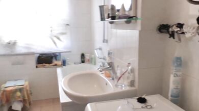 Naked cleaning in the bathroom