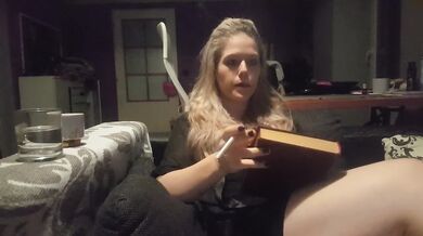 reading a book and smoking cigarette