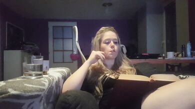 reading a book and smoking cigarette
