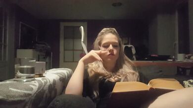 reading a book and smoking cigarette