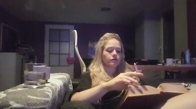 reading a book and smoking cigarette