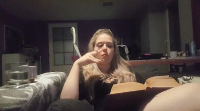 reading a book and smoking cigarette