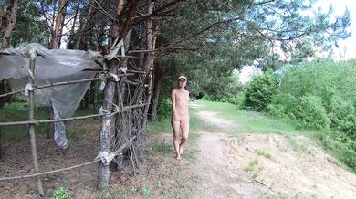 Naked girl on a hiking trip on a SUP board