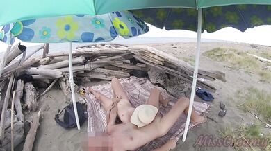 On a nudist beach in Tenerife, the stepdaughter jerks off her stepfather's cock without shame