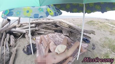 On a nudist beach in Tenerife, the stepdaughter jerks off her stepfather's cock without shame