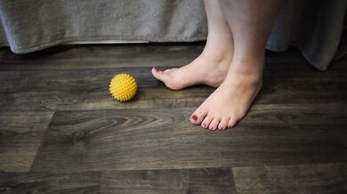 Foot massage with a hedgehog ball