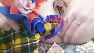Weird girl fucks a clown doll